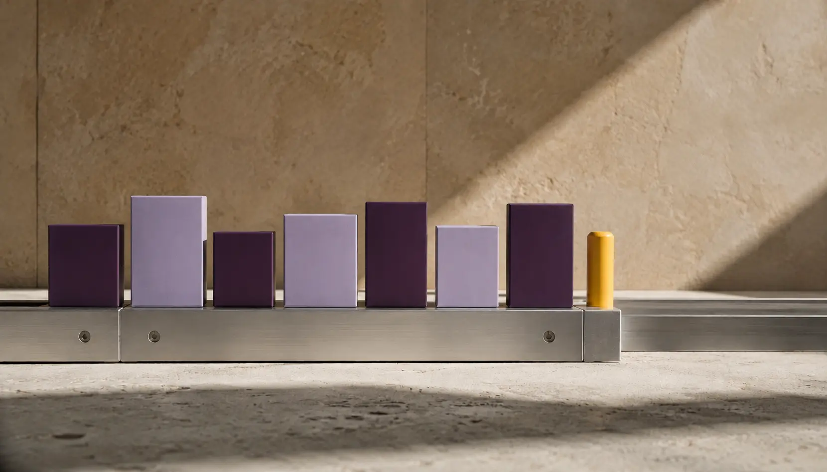 Seven aubergine and lilac product forms waiting behind a single saffron release gate